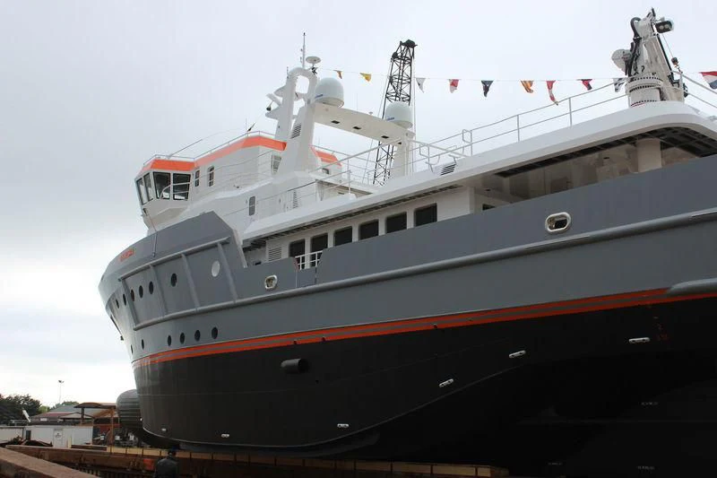 a large ship docked aboard GENESIA Yacht for Sale