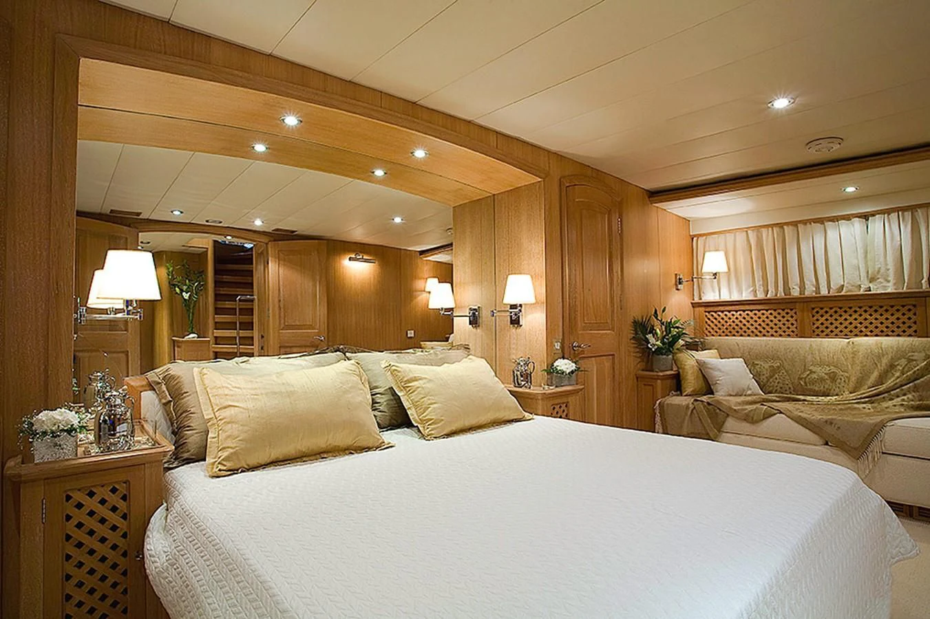 a large bed in a hotel room aboard ALTHEA Yacht for Sale
