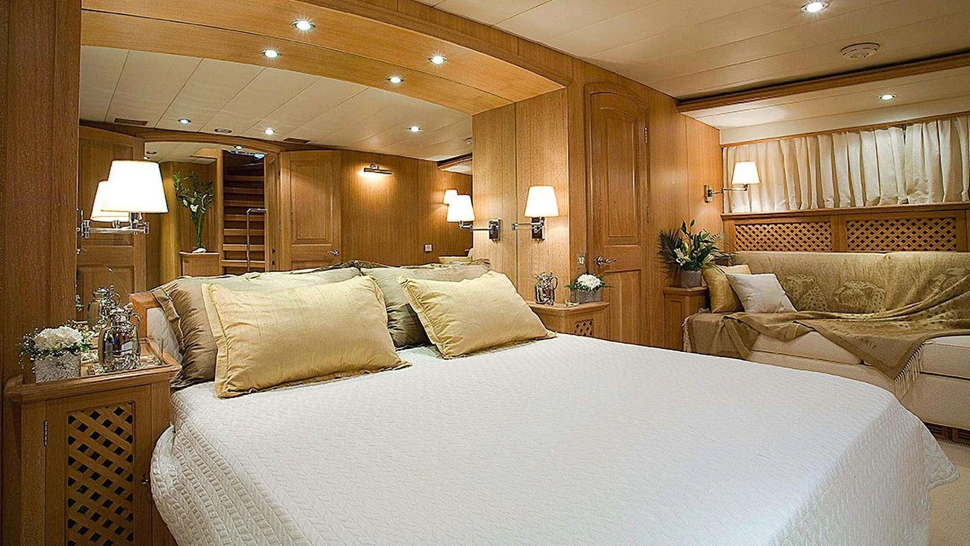 a large bed in a hotel room aboard ALTHEA Yacht for Sale