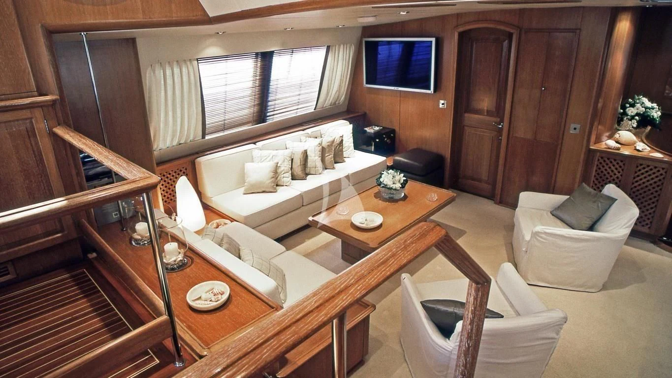 a living room with a couch and a table aboard ALTHEA Yacht for Sale