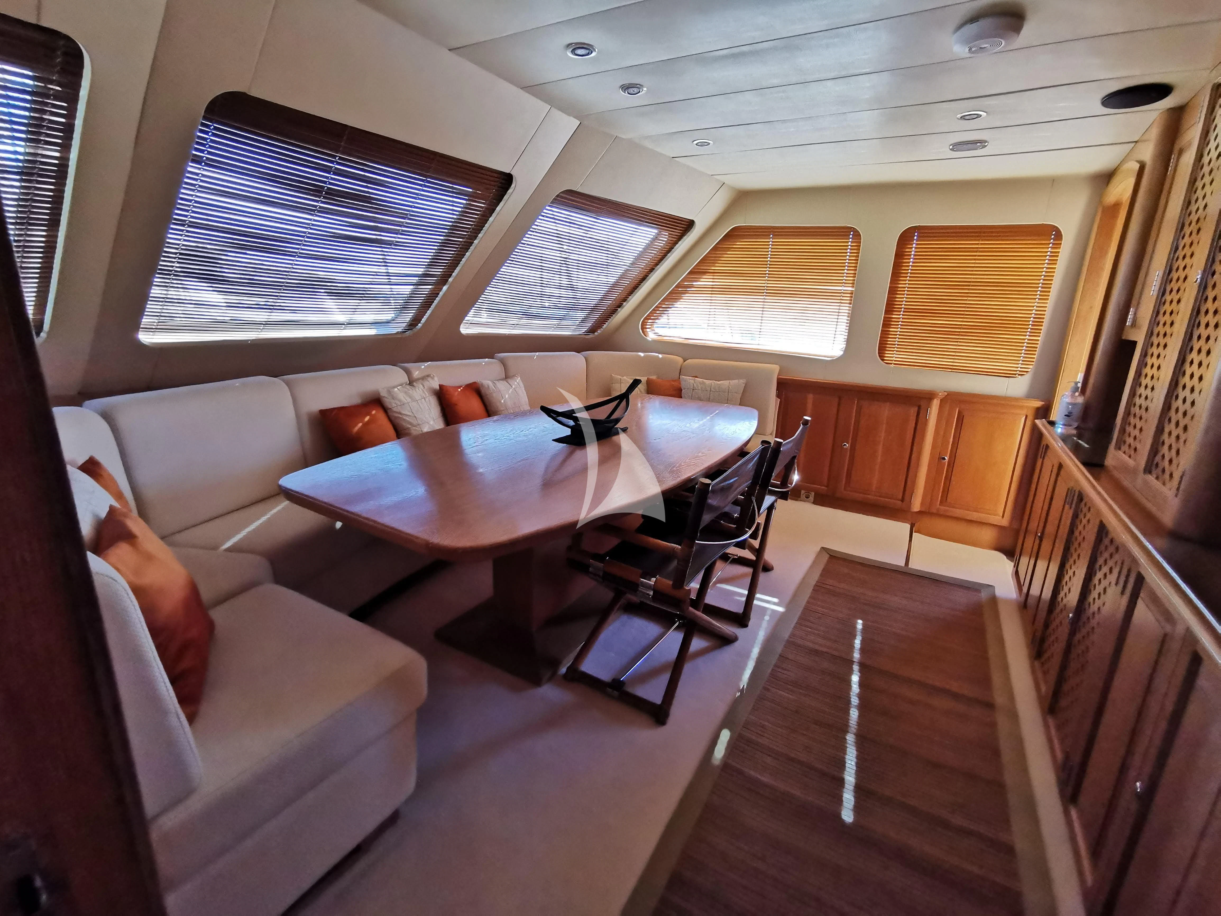 a room with a couch and a table aboard ALTHEA Yacht for Sale