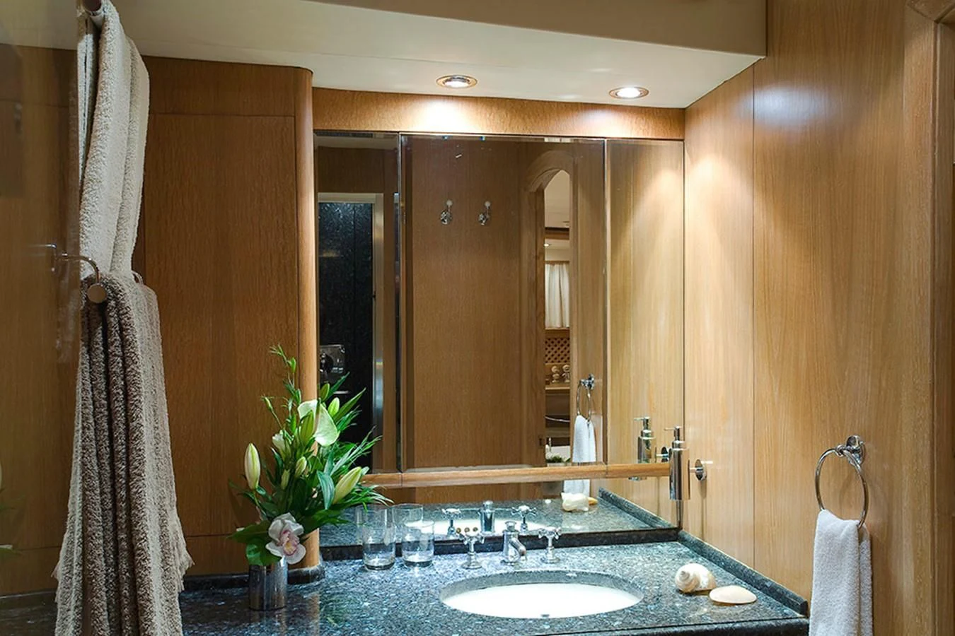 a bathroom with a large mirror aboard ALTHEA Yacht for Sale