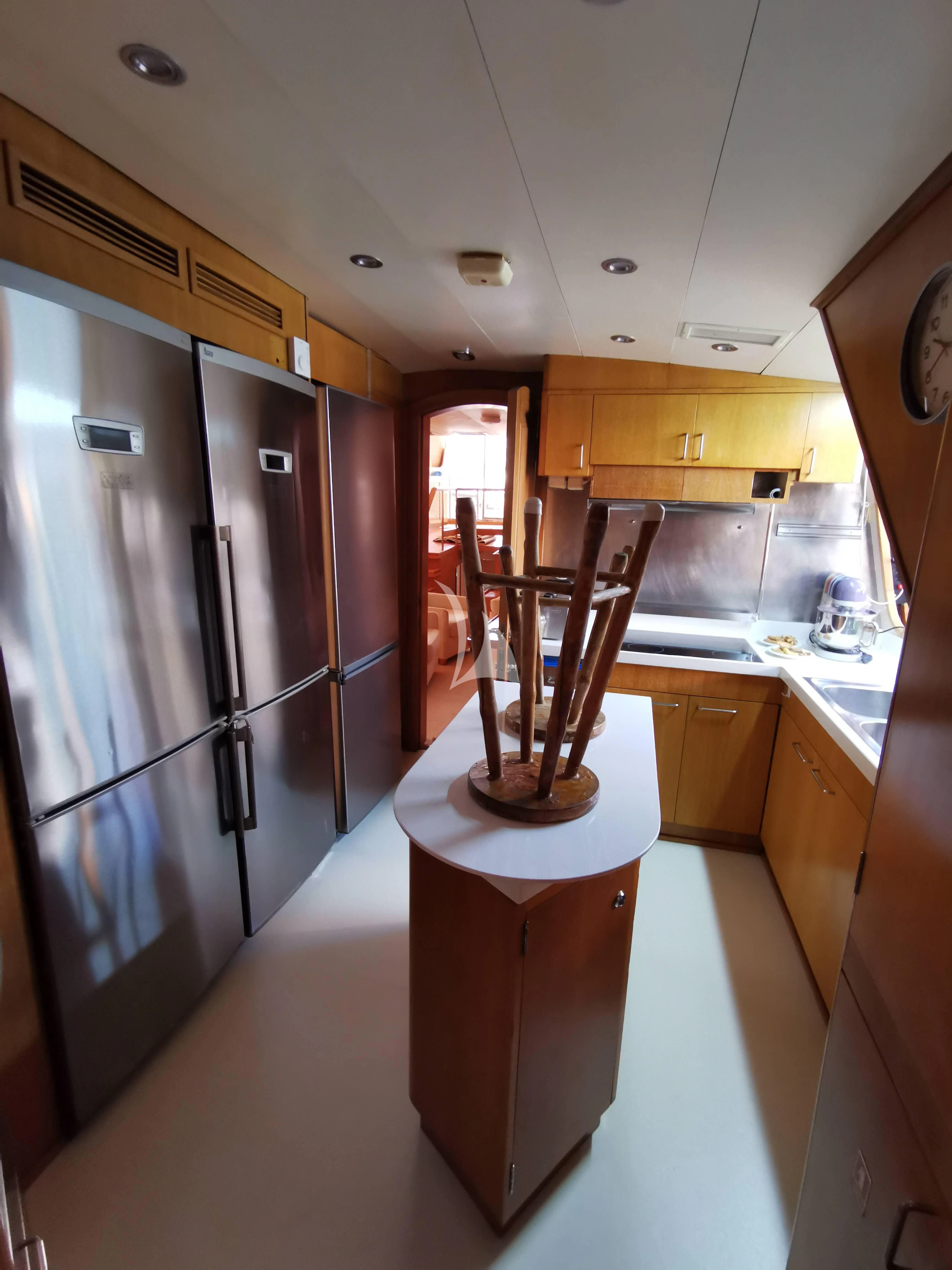 a kitchen with a black railing aboard ALTHEA Yacht for Sale