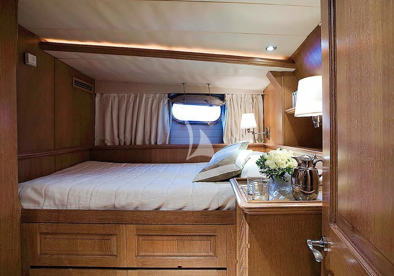 a bed with a mirror above it aboard ALTHEA Yacht for Sale