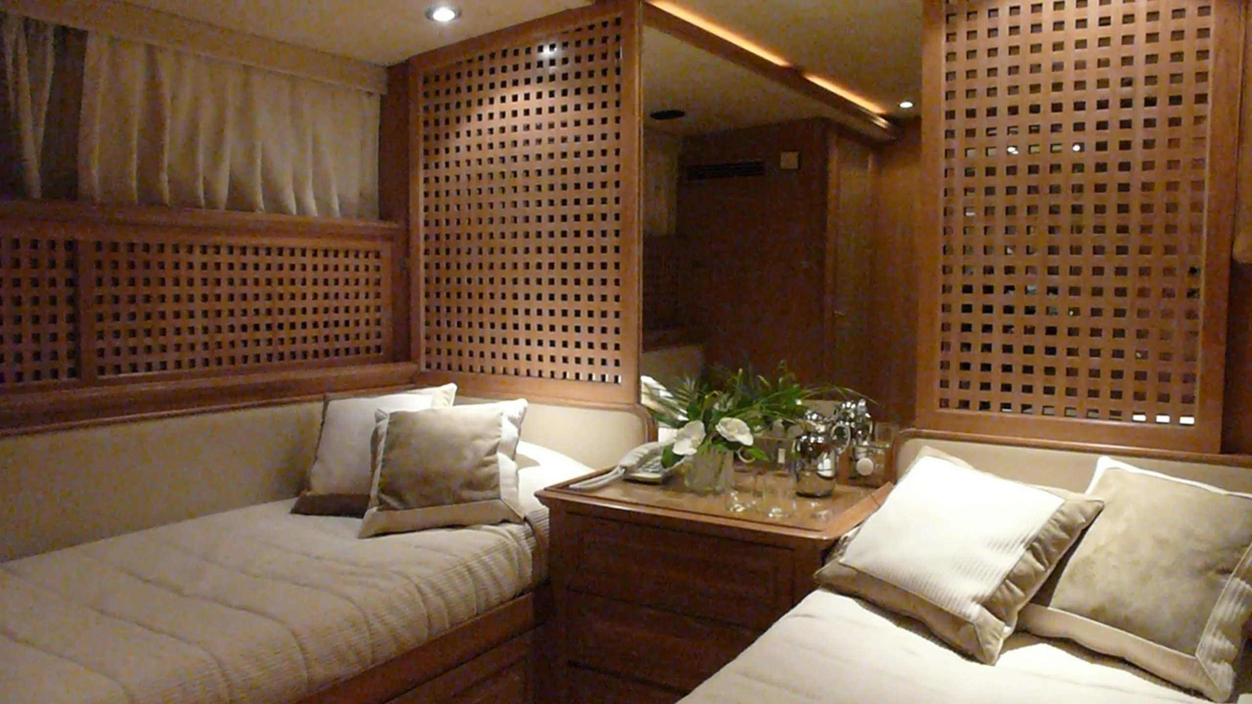 a room with a bed and a window aboard ALTHEA Yacht for Sale