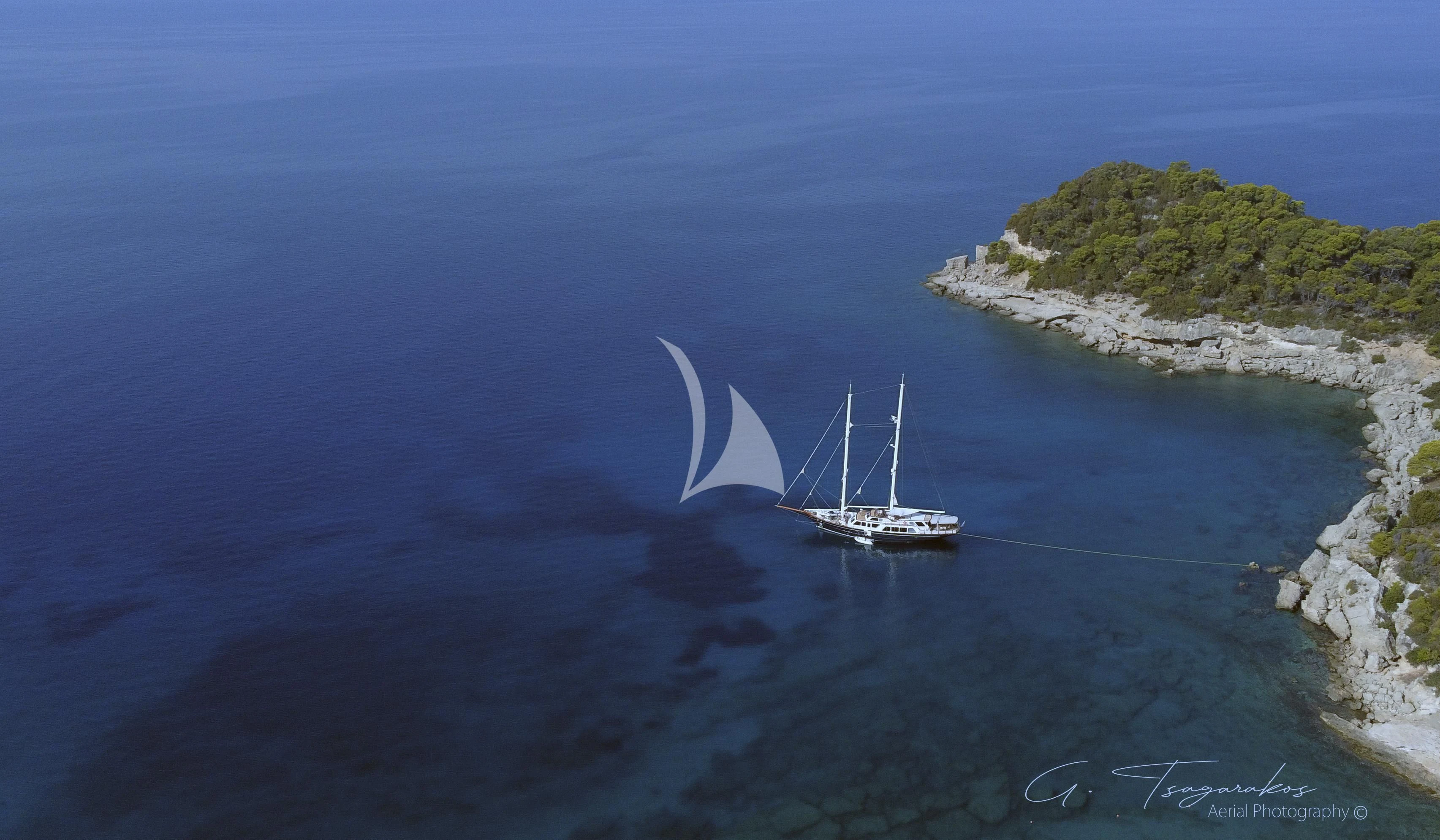a boat sailing in the sea aboard ALTHEA Yacht for Sale