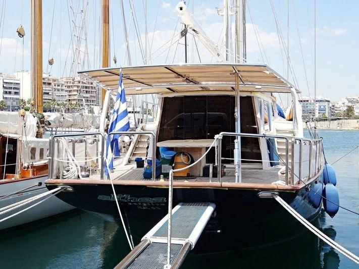 a boat docked in a harbor aboard ALTHEA Yacht for Sale