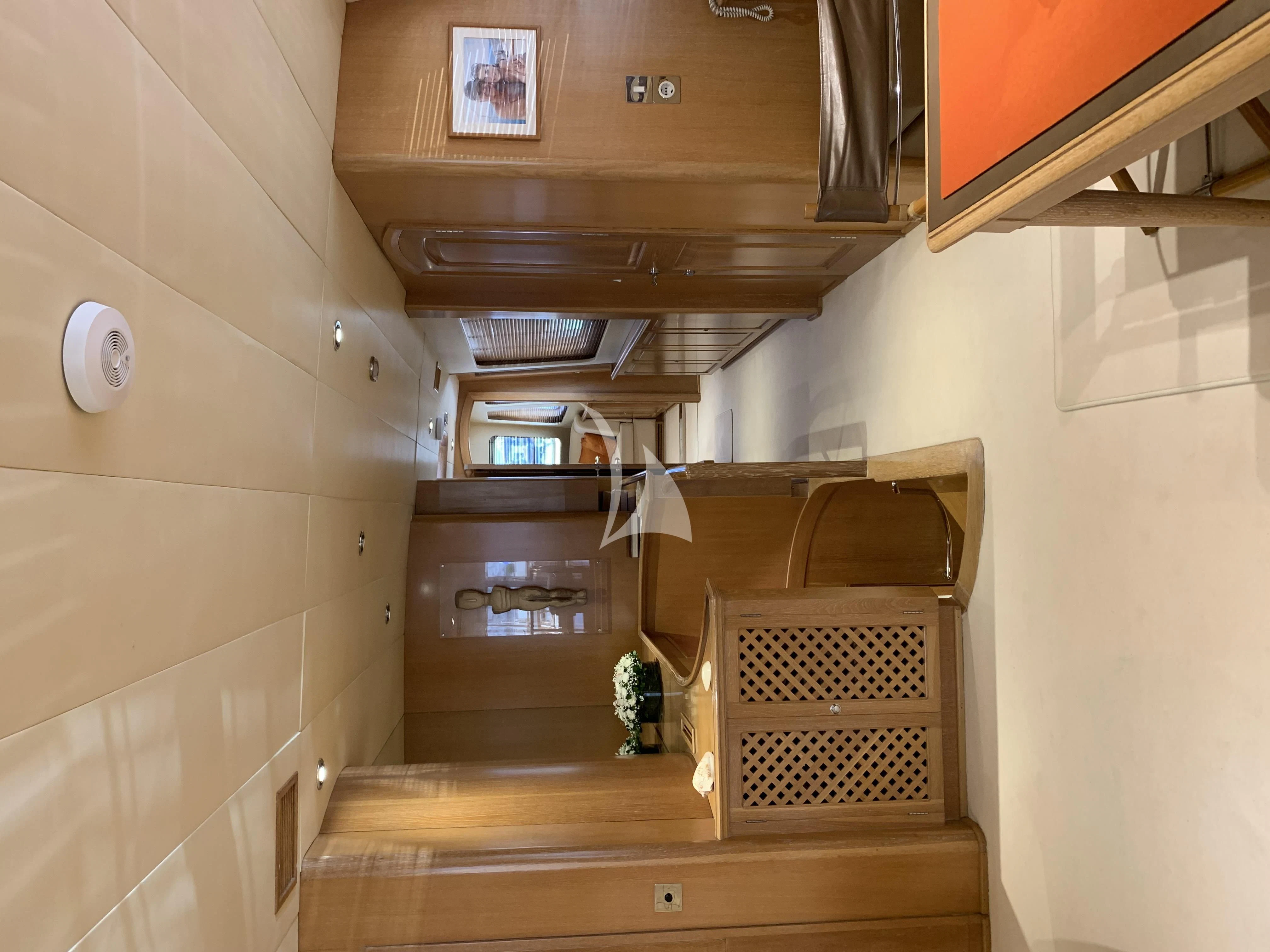 a room with a wood staircase and a wood floor aboard ALTHEA Yacht for Sale