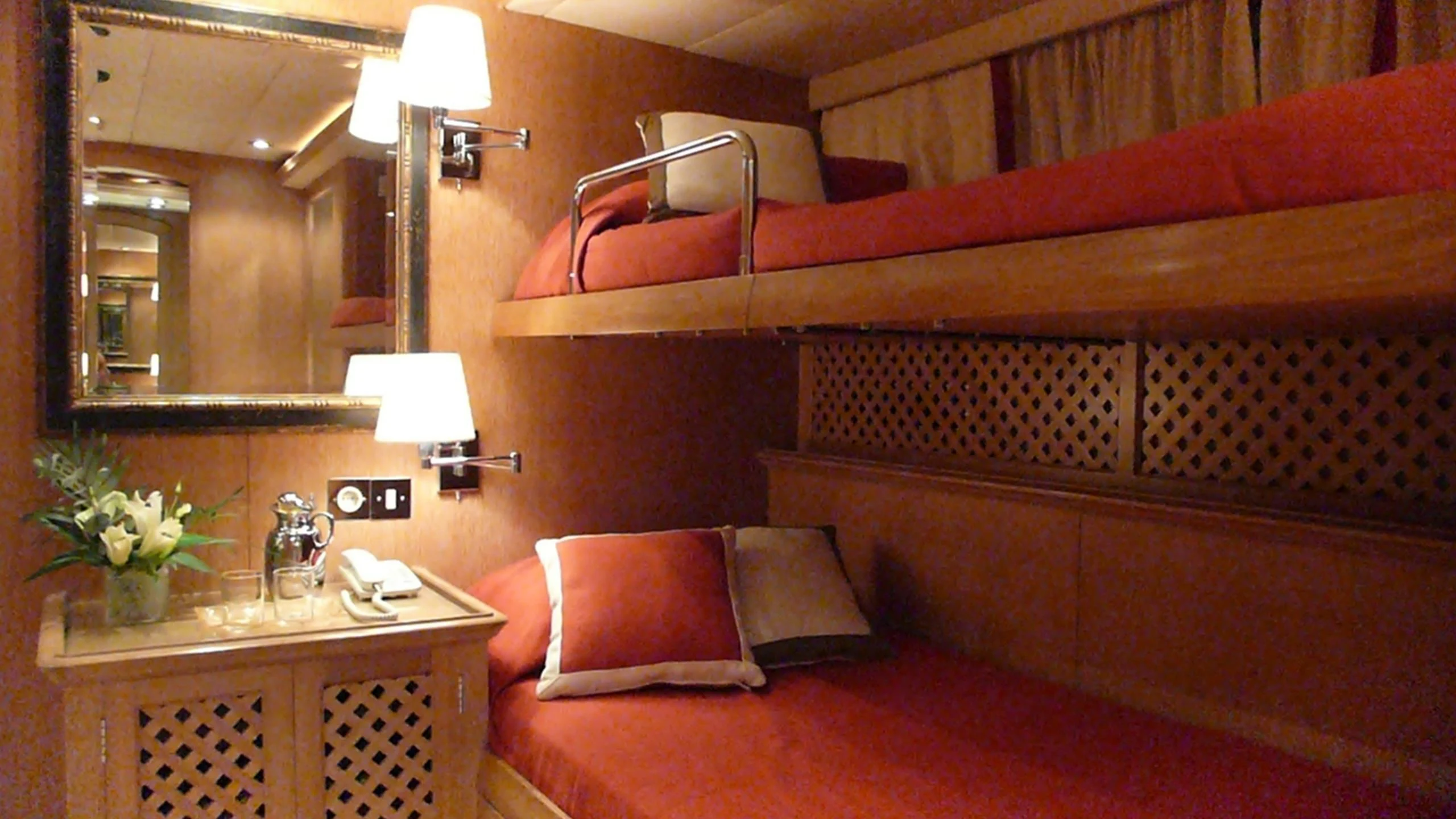 a hotel room with a bed and a desk aboard ALTHEA Yacht for Sale