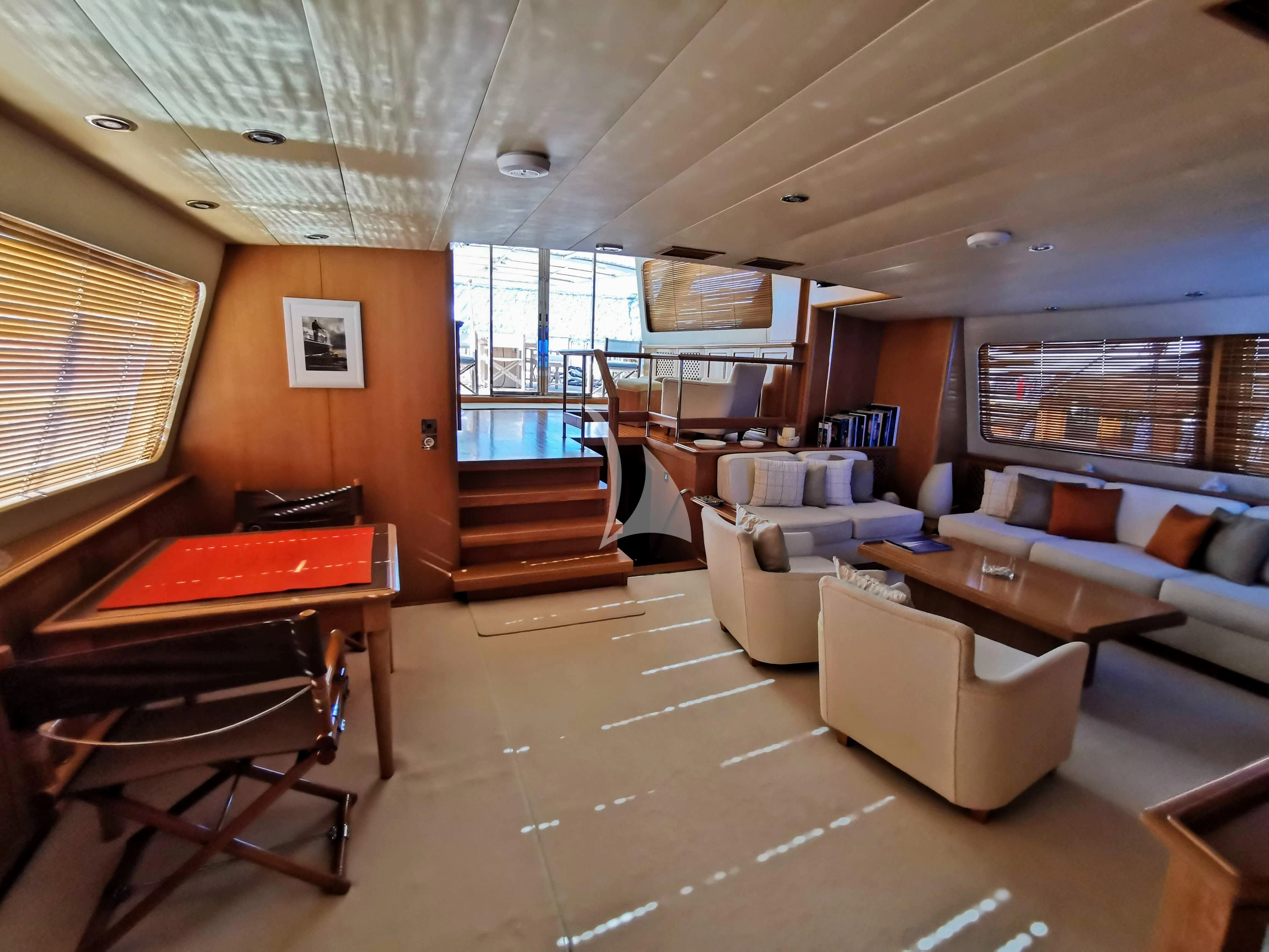 a living room with a large window aboard ALTHEA Yacht for Sale