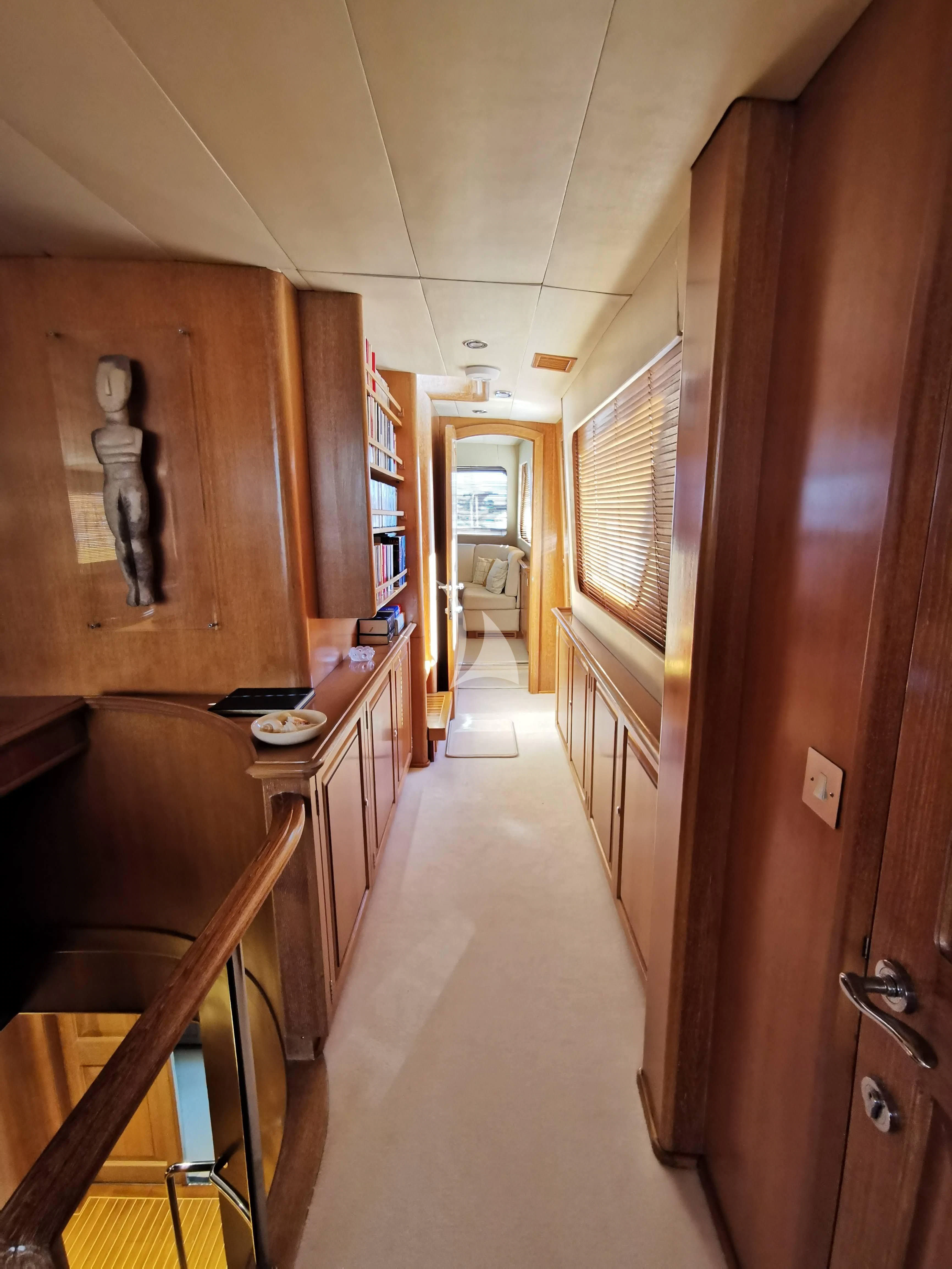 a hallway with wooden cabinets aboard ALTHEA Yacht for Sale