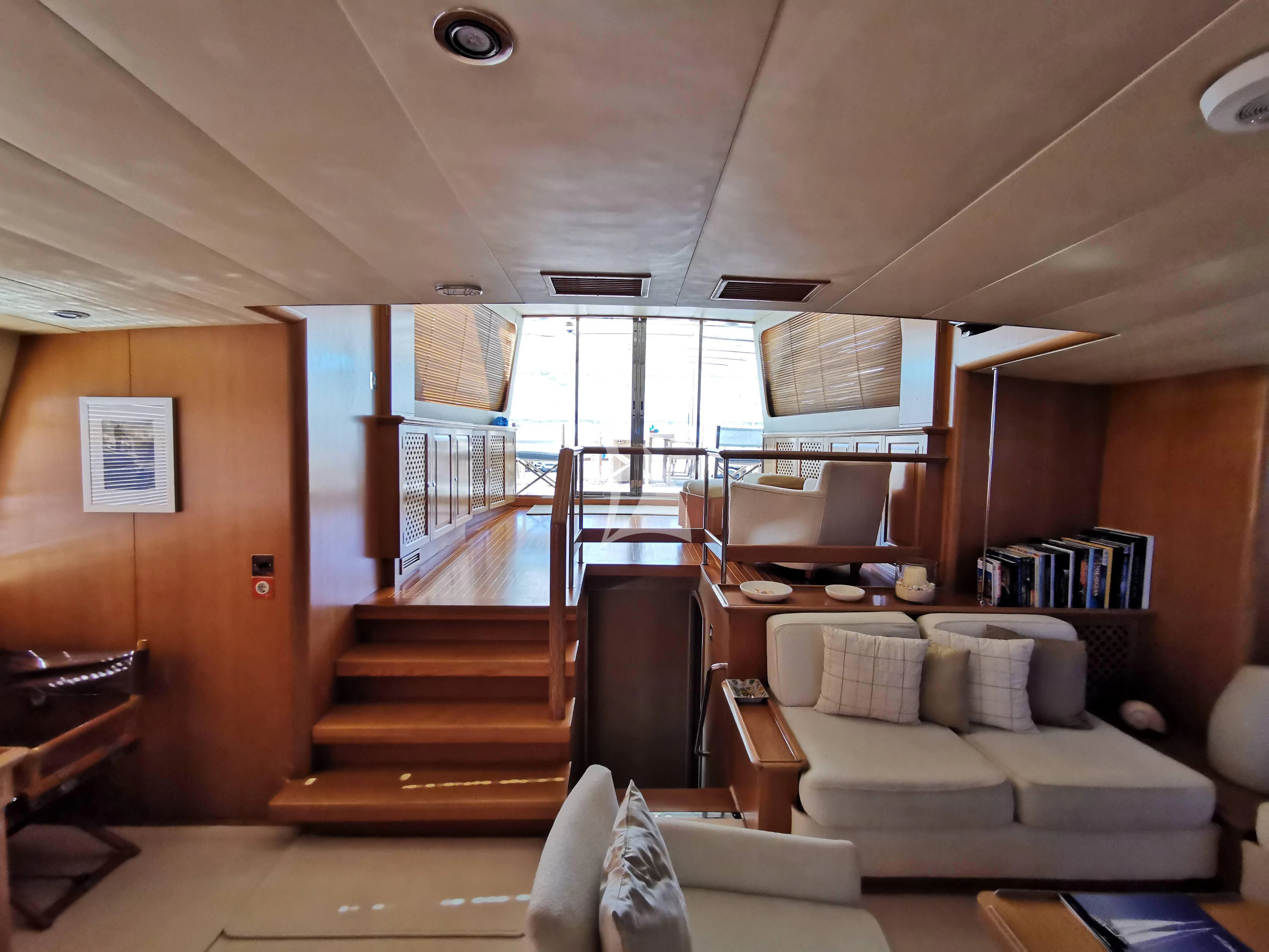 a living room with a large window aboard ALTHEA Yacht for Sale