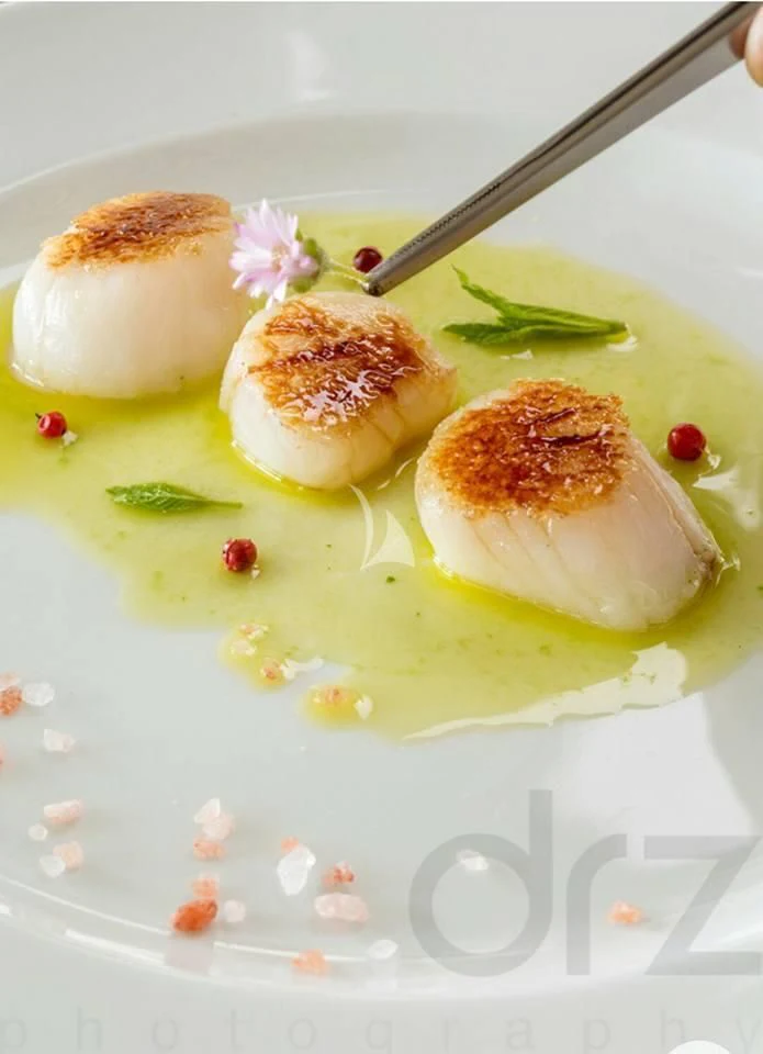 a plate of food aboard ALTHEA Yacht for Sale