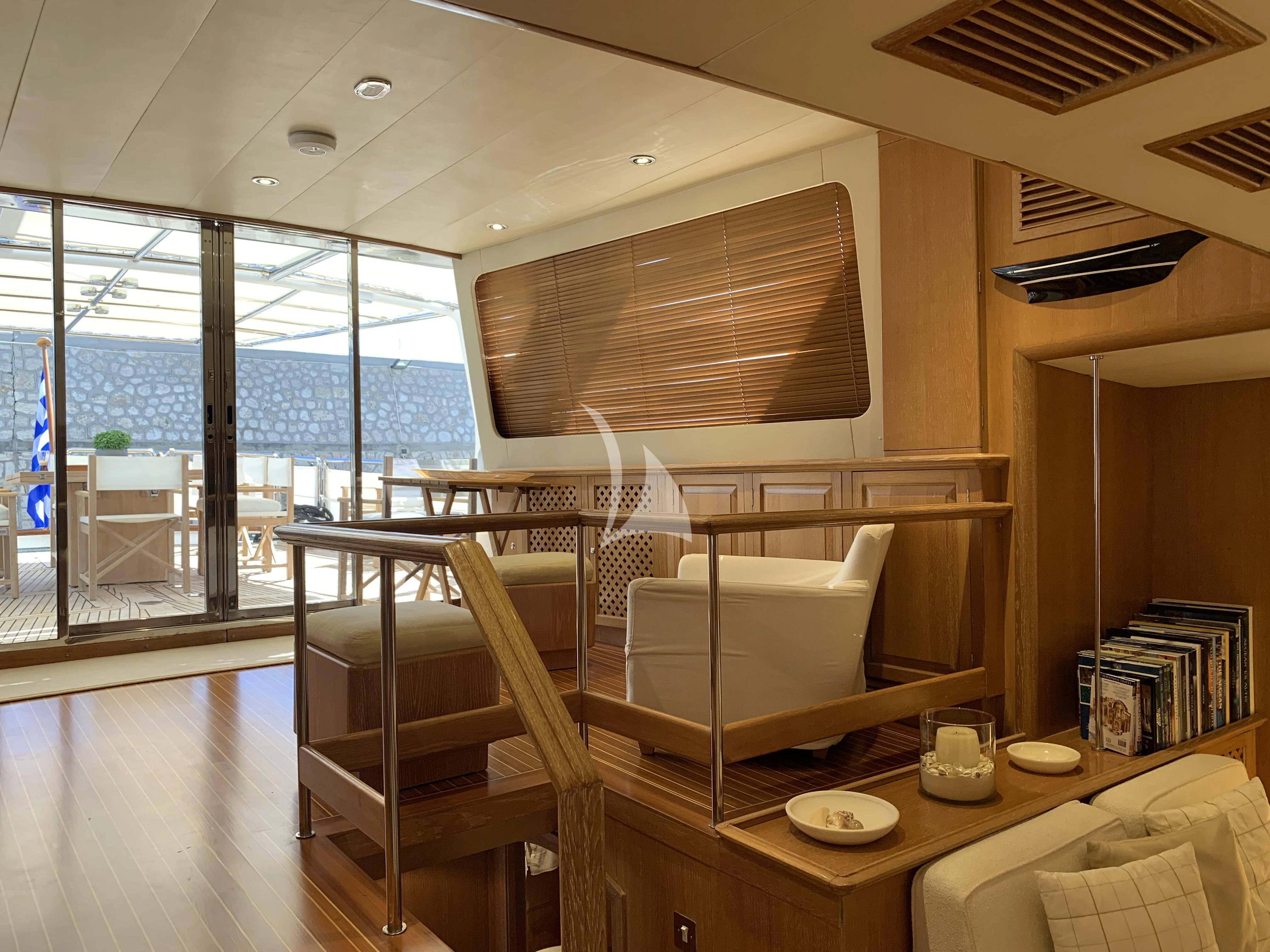 a room with a table and chairs aboard ALTHEA Yacht for Sale