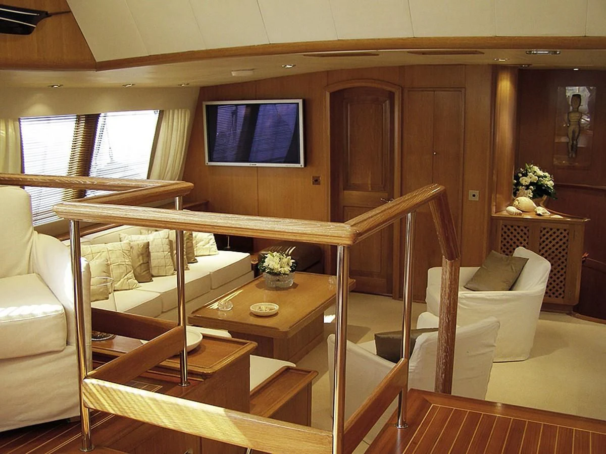 a room with a bed and a tv aboard ALTHEA Yacht for Sale