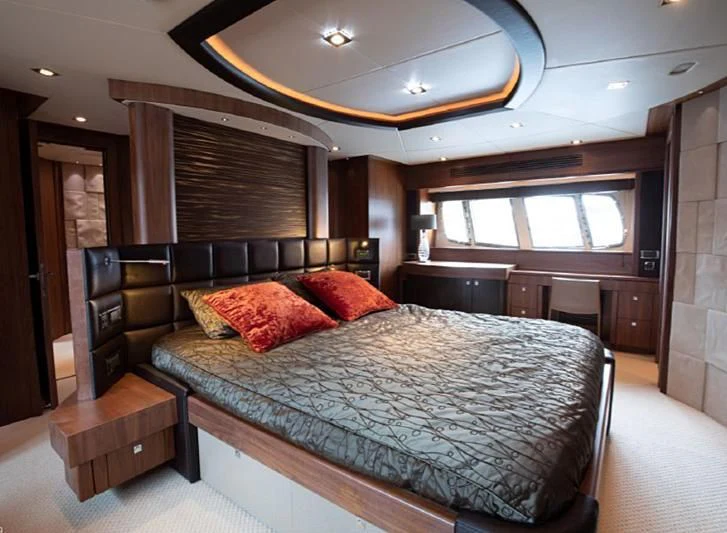 a large bed in a room aboard BARBIZON Yacht for Sale