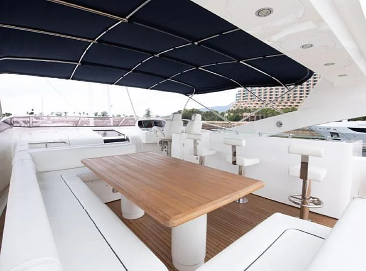 a table with a black umbrella aboard BARBIZON Yacht for Sale