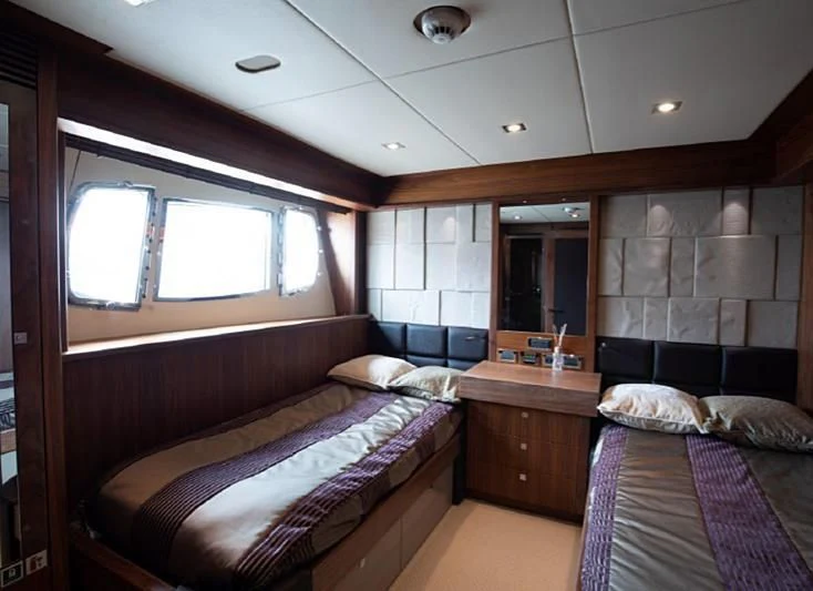 a room with two beds aboard BARBIZON Yacht for Sale