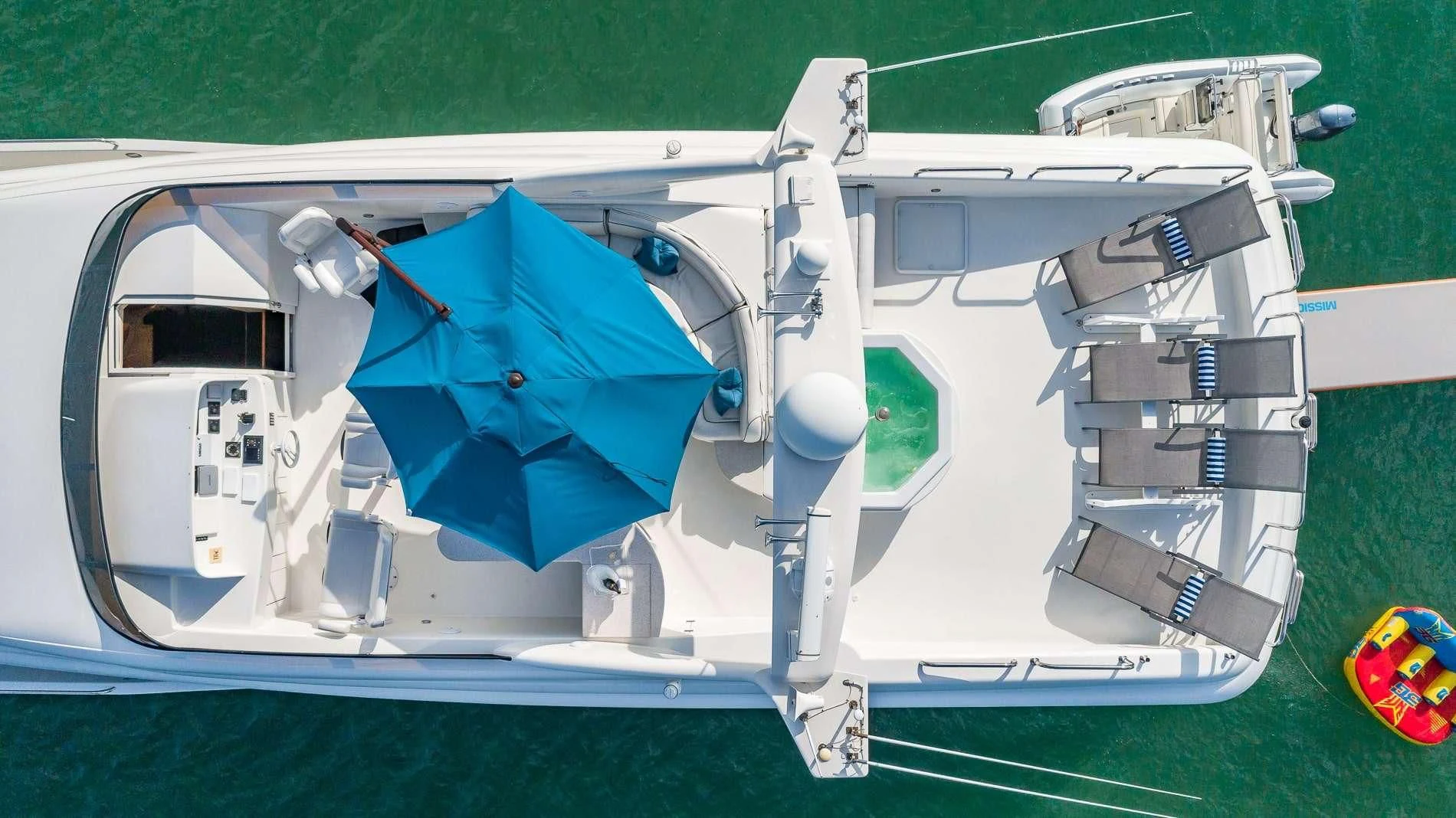 a helicopter on a field aboard TRANQUILITY IV Yacht for Sale