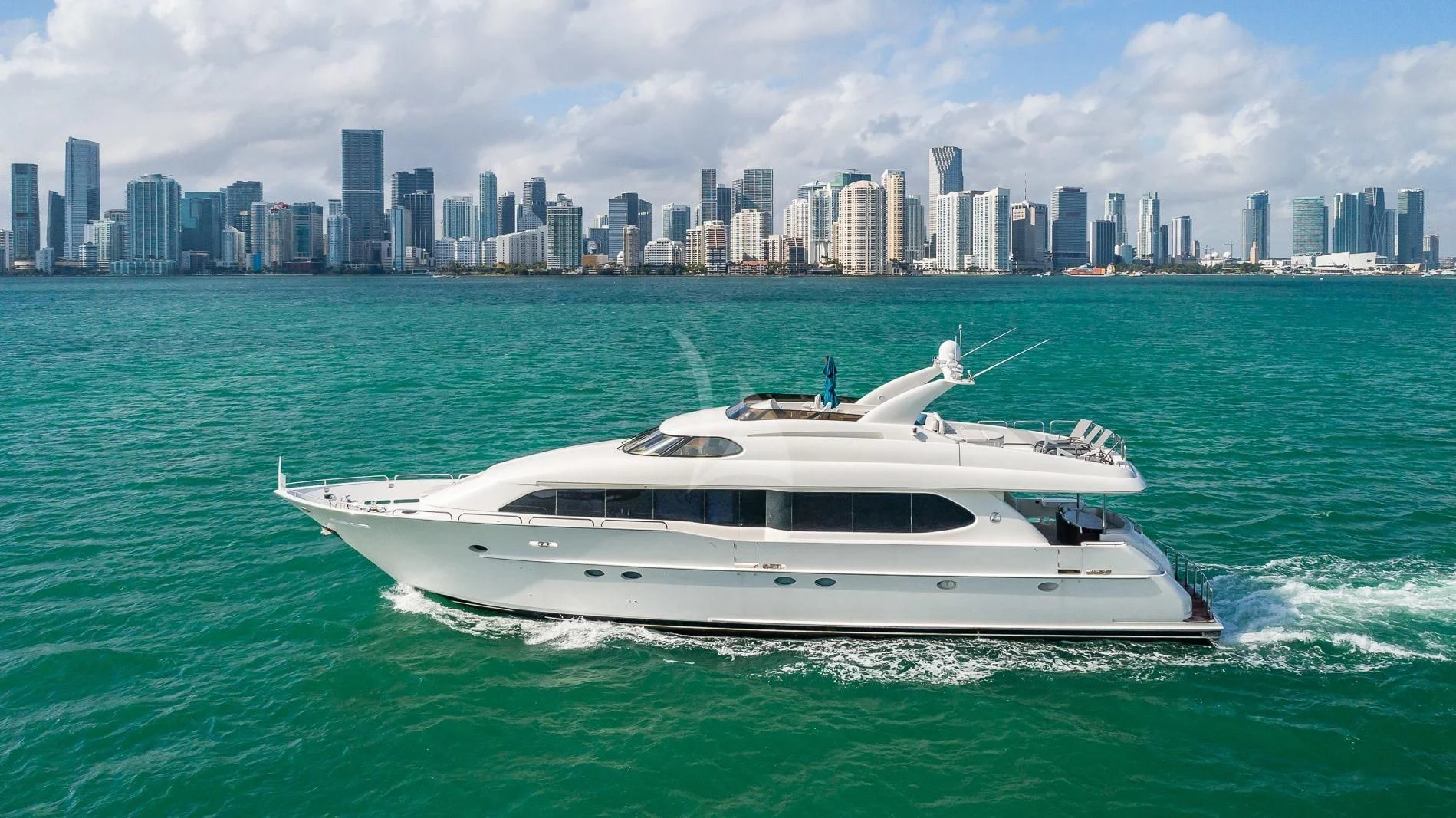 a white yacht in the water aboard TRANQUILITY IV Yacht for Sale