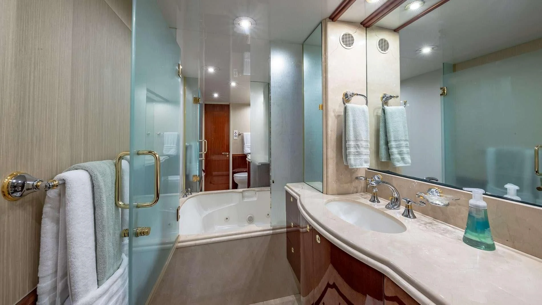 a bathroom with a large mirror aboard TRANQUILITY IV Yacht for Sale