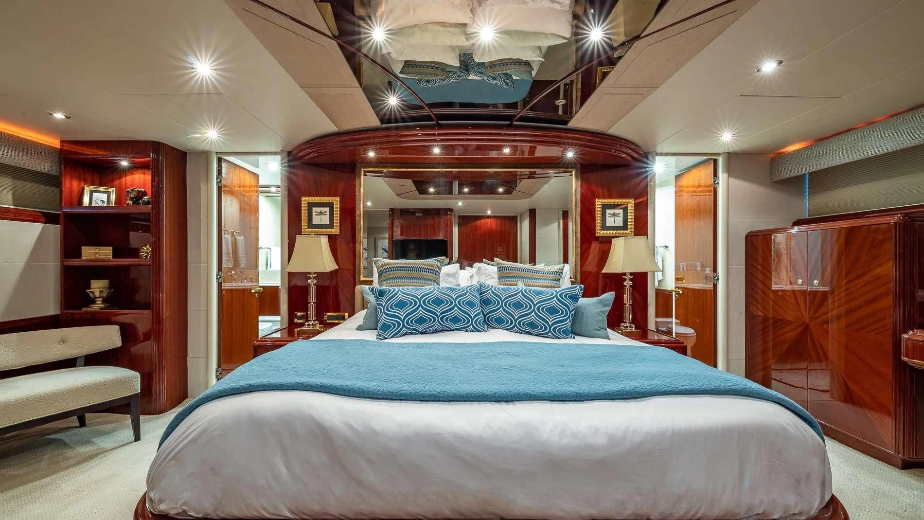 a large bedroom with a large bed aboard TRANQUILITY IV Yacht for Sale