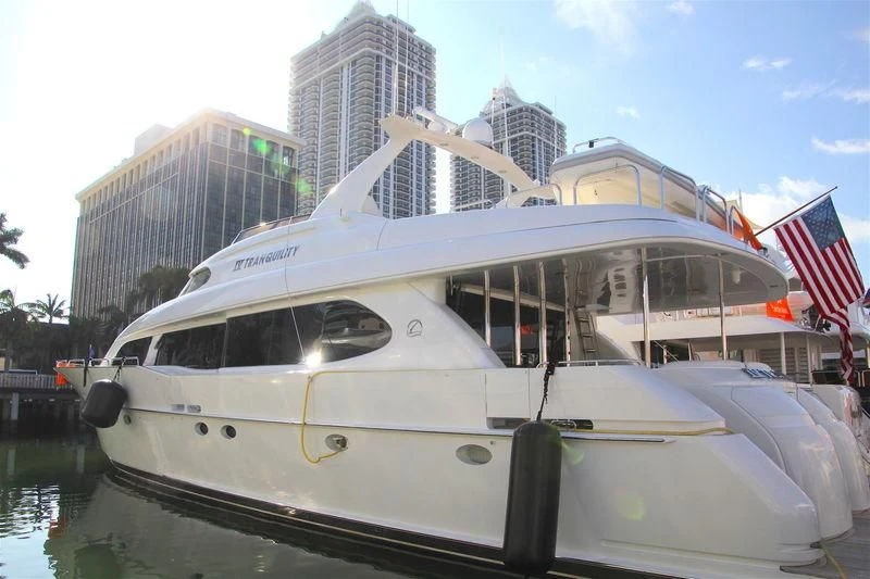 a boat docked at a pier aboard TRANQUILITY IV Yacht for Sale