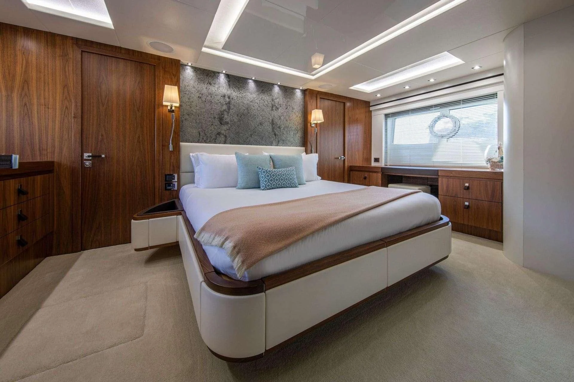 a large bedroom with a large bed aboard RUSH X Yacht for Sale