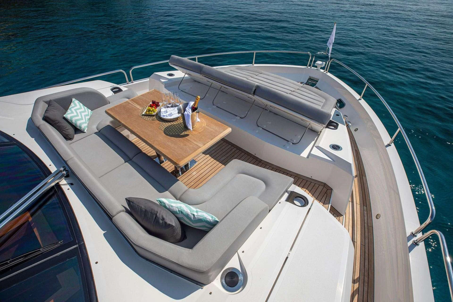 a boat with a table on the deck aboard RUSH X Yacht for Sale
