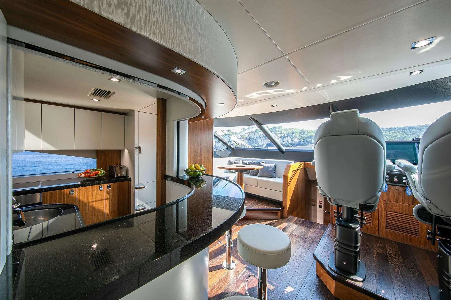 a room with a table and chairs aboard RUSH X Yacht for Sale