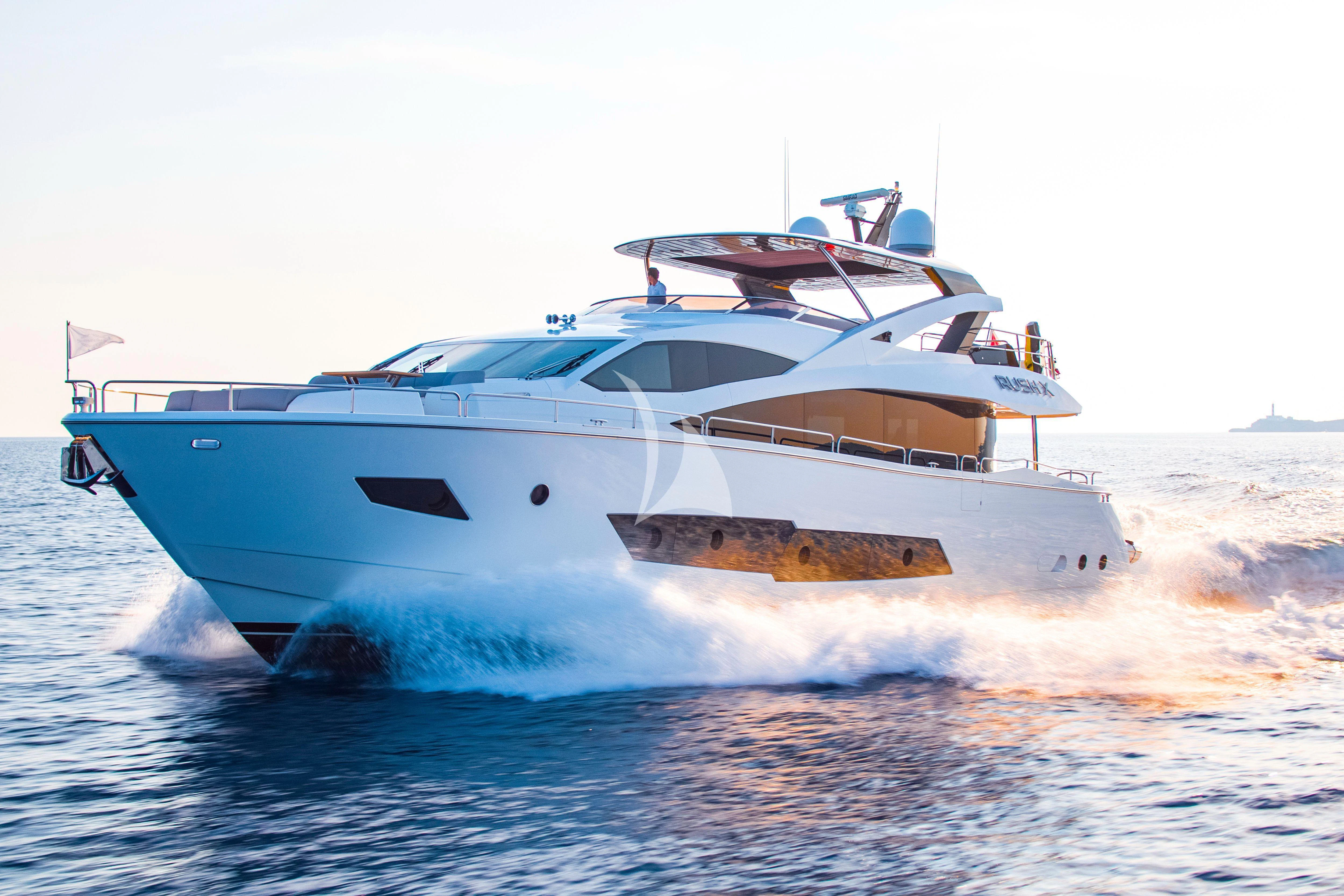a white yacht on the water aboard RUSH X Yacht for Sale