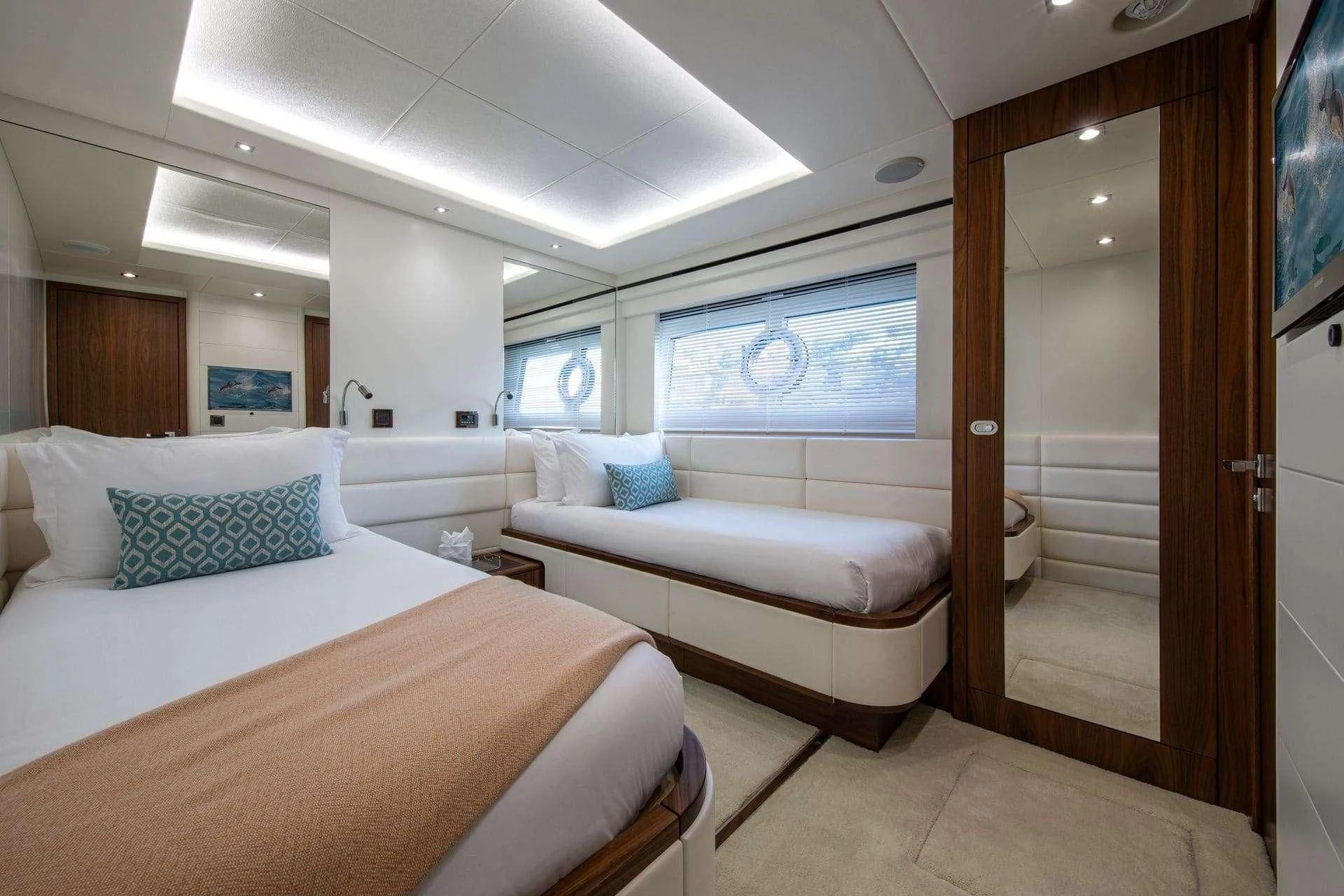 a room with a bed and a door aboard RUSH X Yacht for Sale