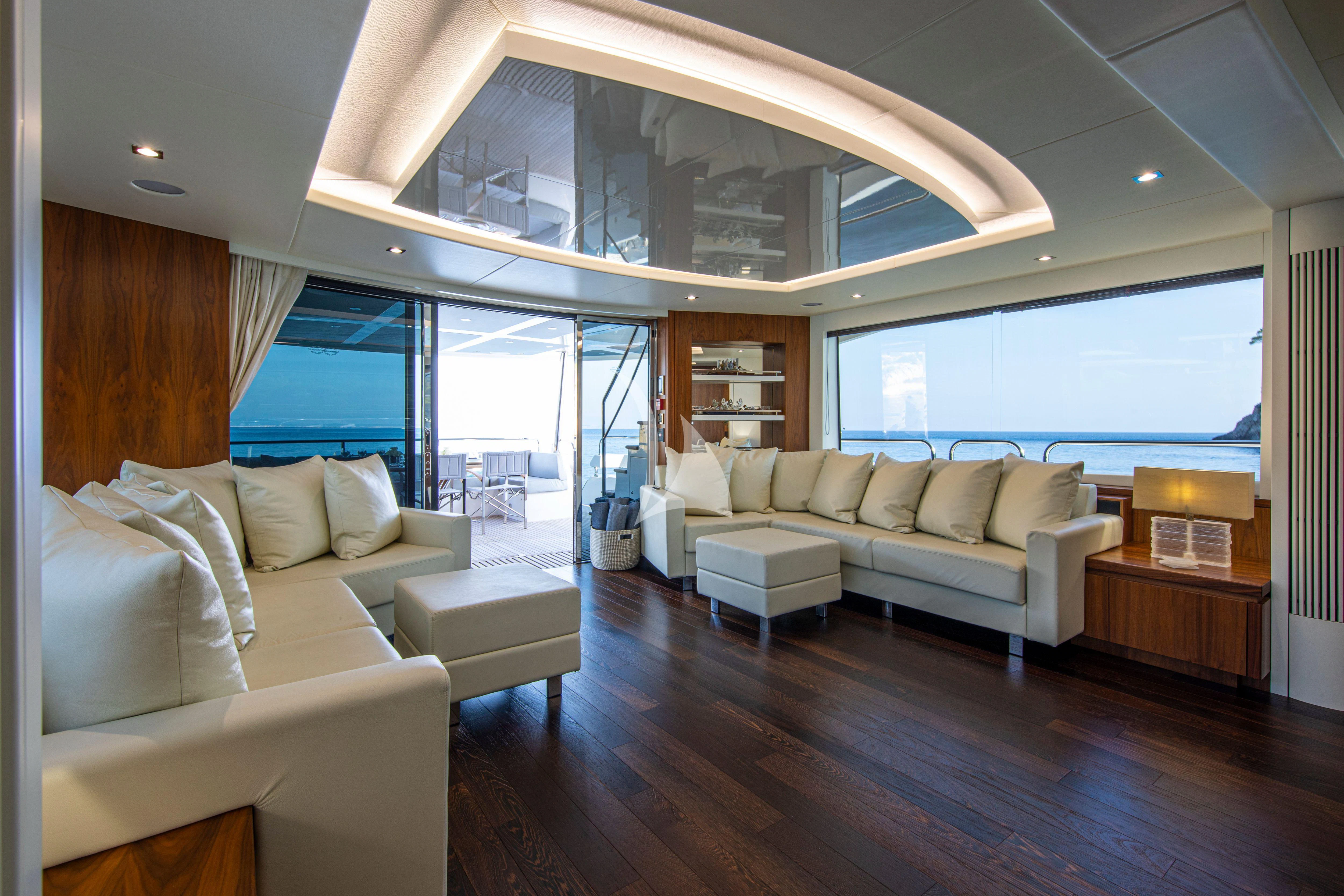 a living room with a large window aboard RUSH X Yacht for Sale