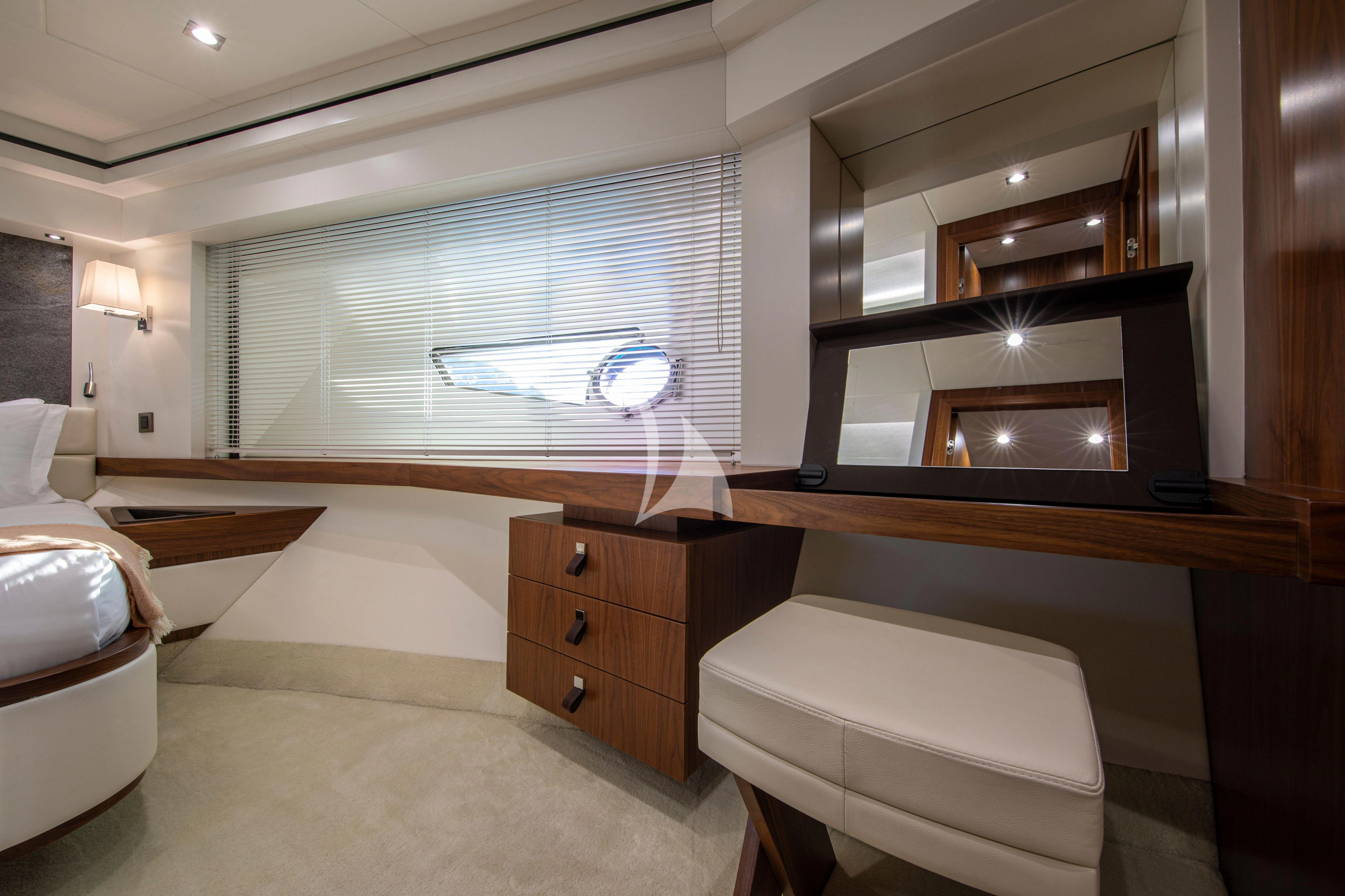 a room with a bed and a mirror aboard RUSH X Yacht for Sale