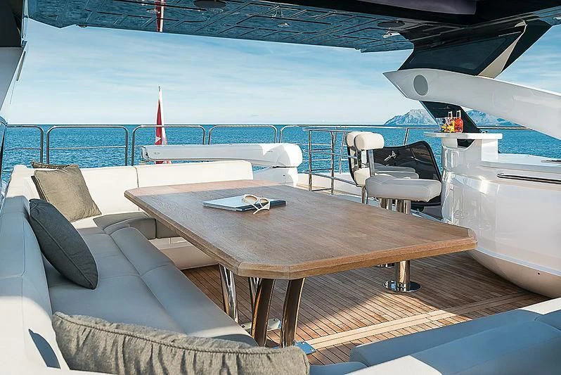 a table on a boat aboard RUSH X Yacht for Sale