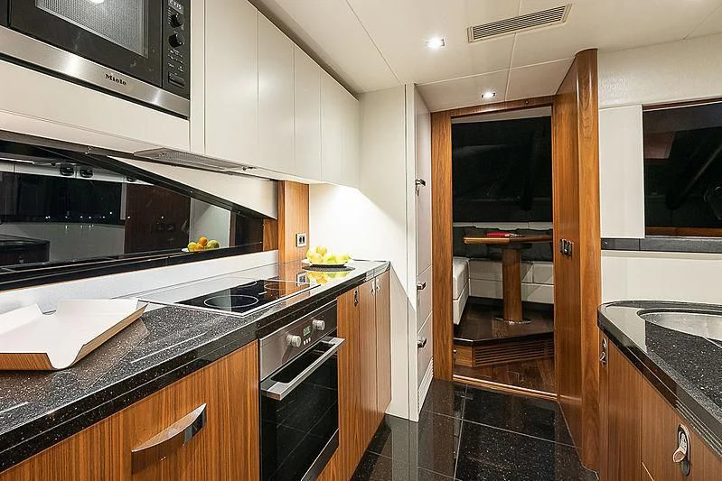 a kitchen with a stove and oven aboard RUSH X Yacht for Sale