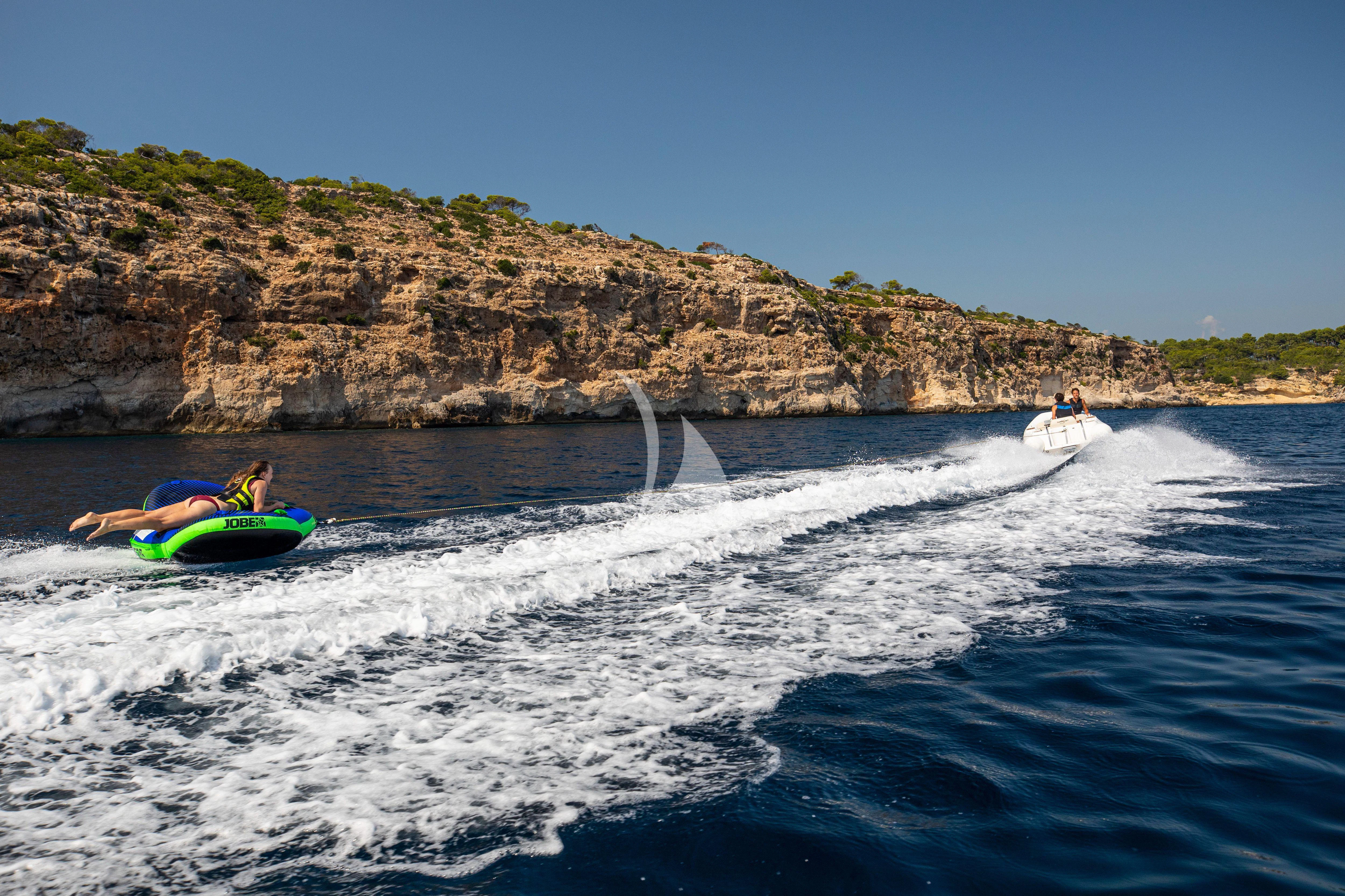 people on a raft in the water aboard RUSH X Yacht for Sale