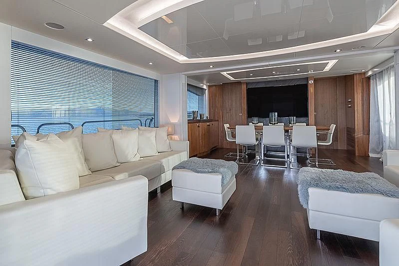 a living room with a wood floor aboard RUSH X Yacht for Sale