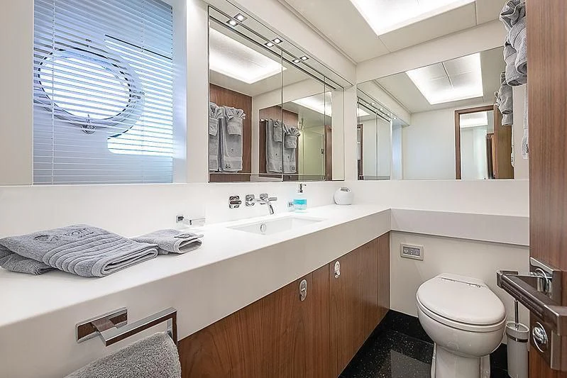 a bathroom with a large mirror aboard RUSH X Yacht for Sale