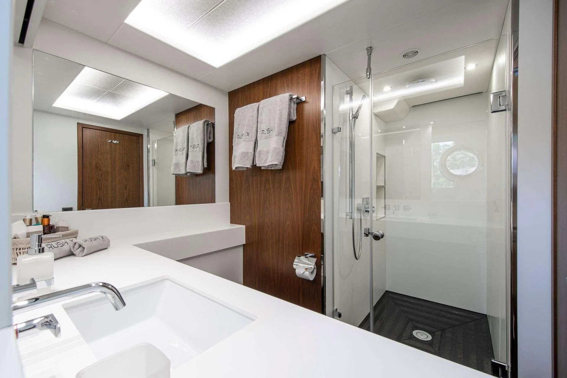 a bathroom with a shower unit and sink aboard RUSH X Yacht for Sale