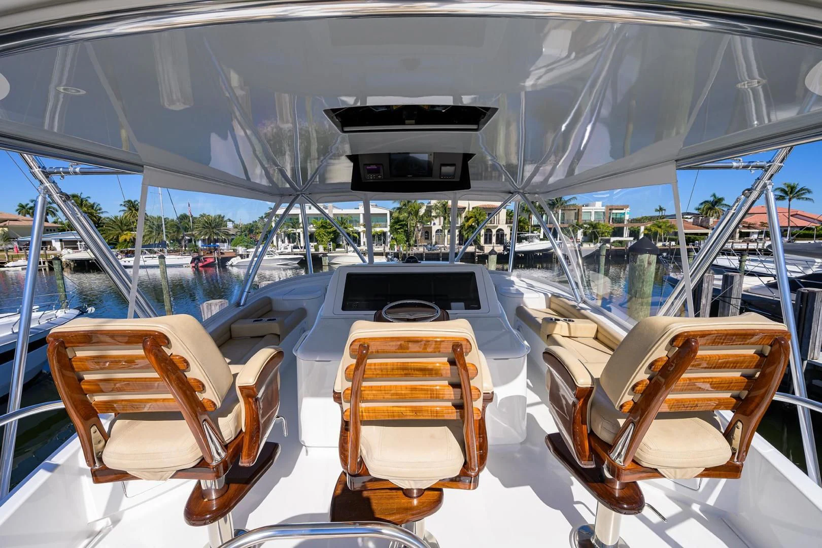 a boat with chairs and a table on it aboard TORO Yacht for Sale
