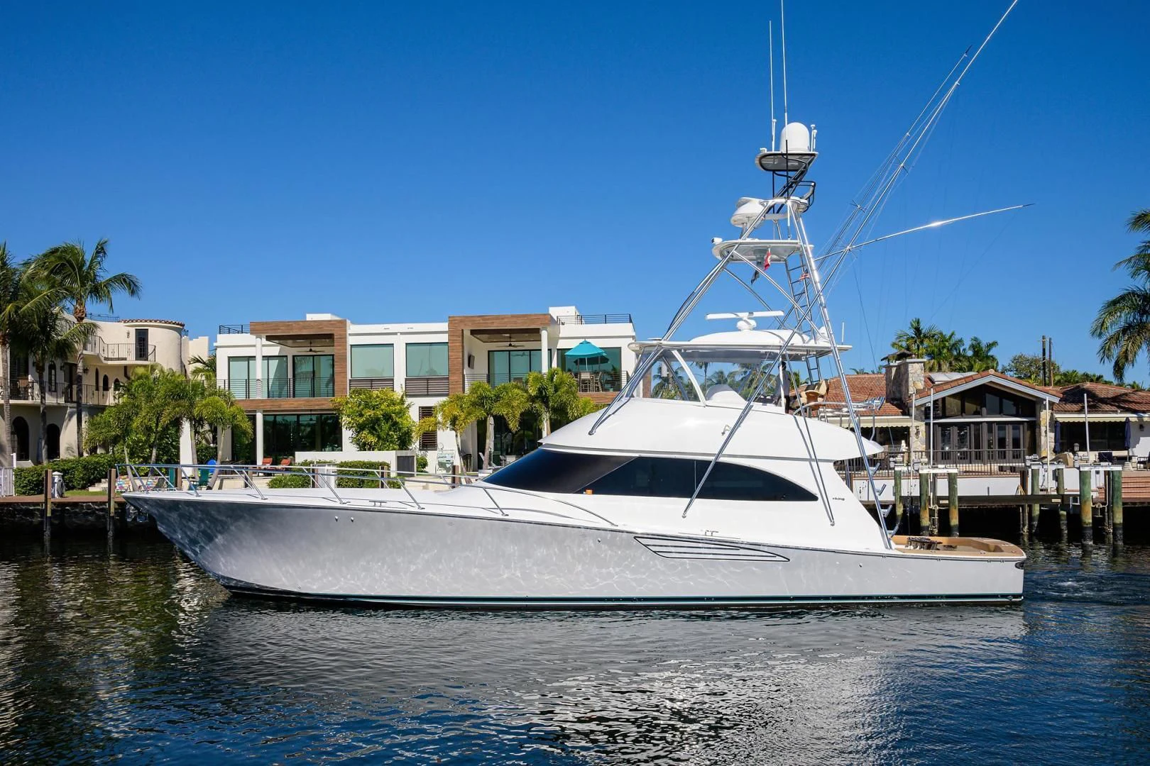 a white boat on the water aboard TORO Yacht for Sale