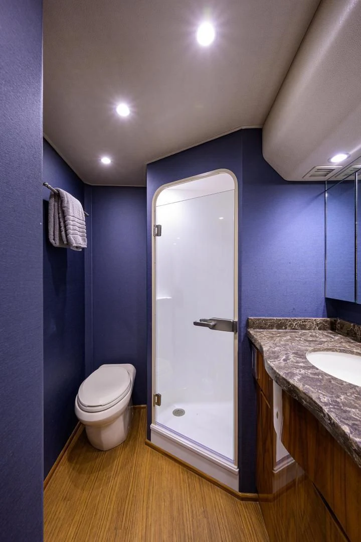 a bathroom with a toilet and a sink aboard TORO Yacht for Sale