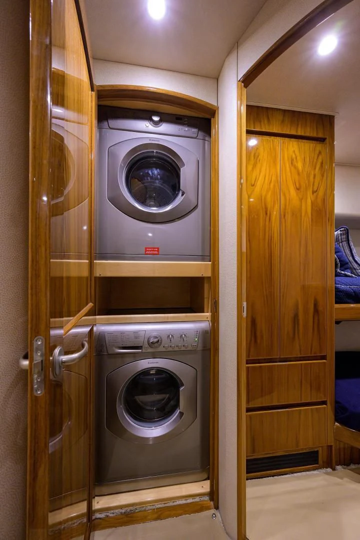 a washer and dryer in a room aboard TORO Yacht for Sale