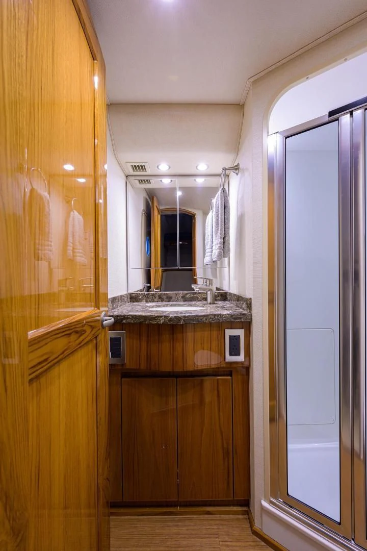 a bathroom with a sink and a mirror aboard TORO Yacht for Sale