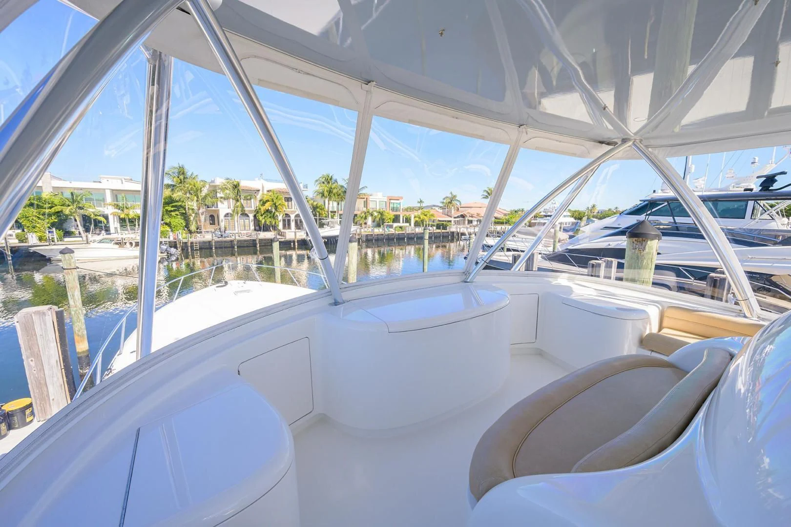 a large white boat in a large room with windows aboard TORO Yacht for Sale