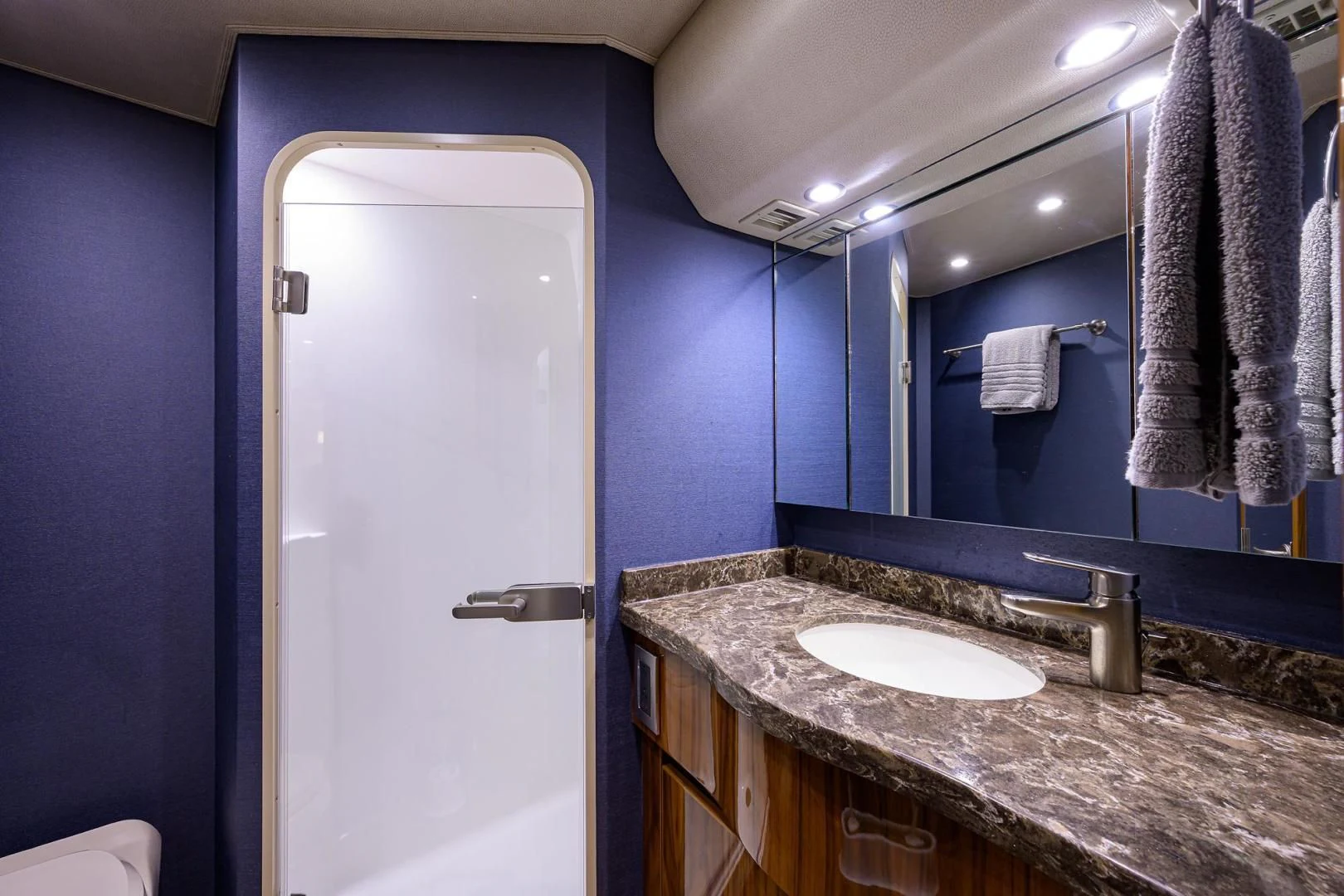 a bathroom with a marble countertop aboard TORO Yacht for Sale