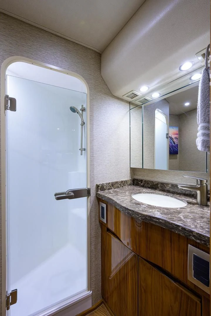 a bathroom with a sink and a mirror aboard TORO Yacht for Sale