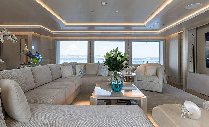 a living room with a large window aboard VOLPINI 2 Yacht for Sale