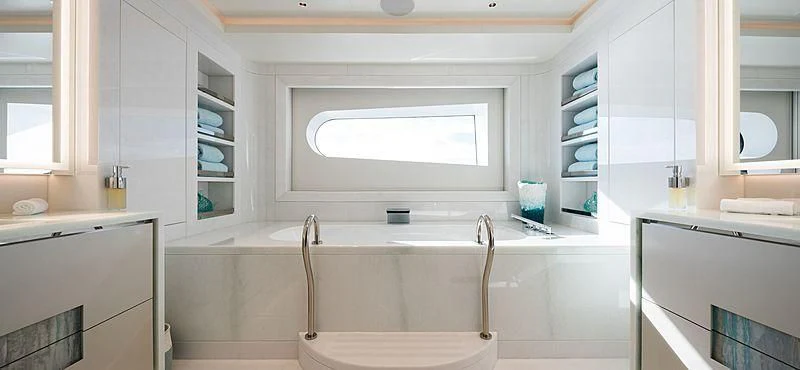 a bathroom with a tub and shelves aboard VOLPINI 2 Yacht for Sale